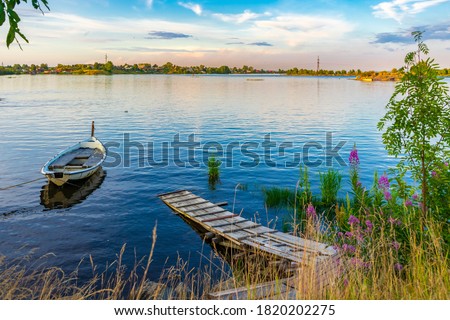 Similar – Wooden planked footway in calm evening lake