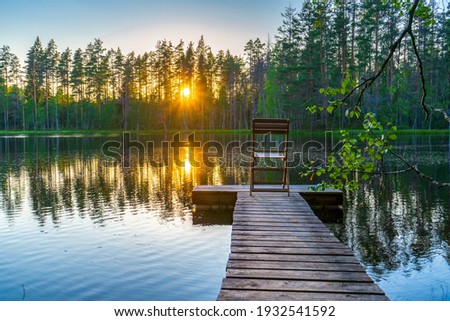 Similar – Wooden planked footway in calm evening lake