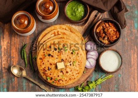 Similar – Image, Stock Photo Indian flatbreads on a blue background, above view. Homemade naan bread