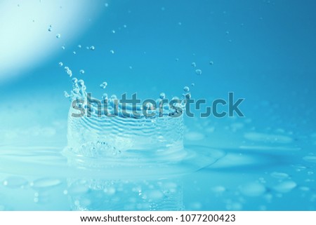 Water splash background / Water is a transparent, tasteless, odorless, and nearly colorless chemical substance that is the main constituent of Earth's streams, lakes, and oceans, and the fluids of mos Stock fotó © 