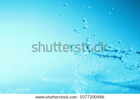 Water splash background / Water is a transparent, tasteless, odorless, and nearly colorless chemical substance that is the main constituent of Earth's streams, lakes, and oceans, and the fluids of mos Stock fotó © 