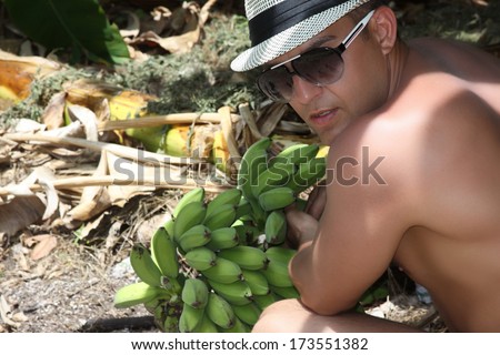 Man in a Malediven banana plantation. Ecology concept