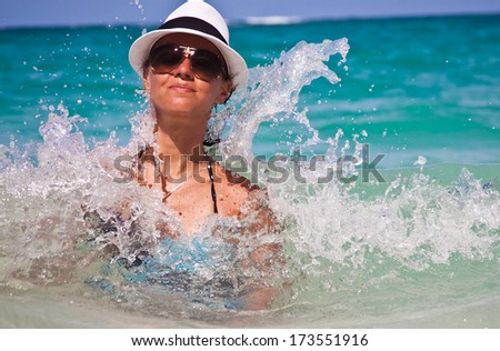 Beauty Girl Swimming in the Caribbean Sea. Hot Girl enjoying the Waves of the Sea.