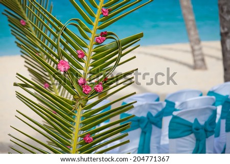 Wedding archway on tropical Caribbean beach.