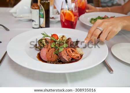 Hot Meat Dishes-Fillet of beef with apple jelly. Dinner at luxury restaurant. (selective focus)