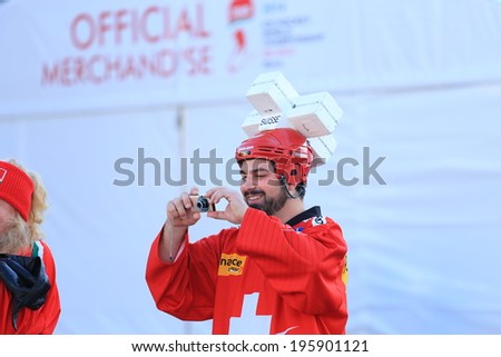 MINSK, BELARUS - MAY  14,2014: 2014 IIHF Ice Hockey World Championship Belarus Minsk Swiss fan taling a picture smiling in a uniform