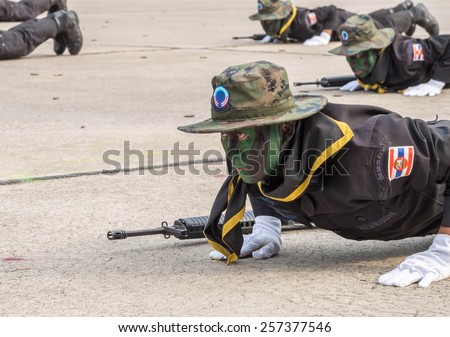 CHONBURI, THAILAND - JAN 18, 2015 : Unidentified Navy SEAL\
performing combat training in Military Parade of Royal Thai Navy on\
January 18, 2015 at Sattahip Naval Base, Chonburi, Thailand