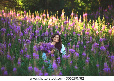 Beautiful provence woman relaxing in lavender field watching on sunset holding . Series. alluring girl with purple lavender. Ã�Â±Ã??Ã??Ã�Â½Ã�ÂµÃ??Ã�ÂºÃ�Â° lady in blossom field . Ukraine -  Ã�Â»Ã??Ã�Â²Ã??Ã�Â²