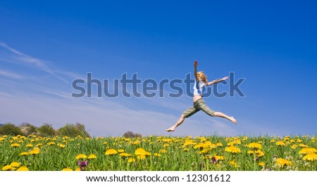 young female having fun on flowery meadow
