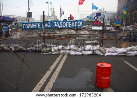 KIEV, UKRAINE - DEC 20: Barricades at Euromaidan square during anti-government protest and a big banner \