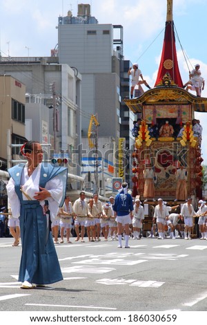 KYOTO-JULY 17: Procession of traditionally clothed people and big floats during Gion Festival (Gion Matsuri) on July 17 2010 in Kyoto, Japan. Gion festival is one of the most famous festivals in Japan