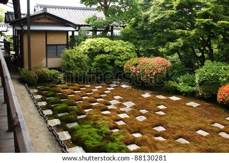 Japanese zen garden: square cutted stones and moss in a chequered pattern.
