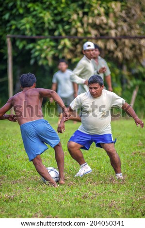 LORETO, PERU - JANUARY 02: Unidentified locals playing football in a small village in the middle of the Amazon Rain Forest, on January 02, 2010 in Loreto, Peru.
