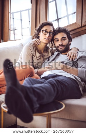 Young couple paying attention to TV