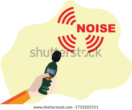 Hand holding sound level meter used for noise monitoring 