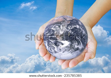 Protect nature by hand Elements of this image furnished by NASA