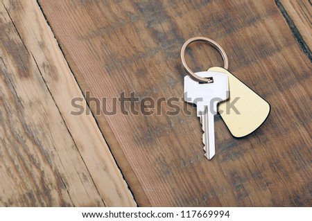 silver key with blank tag