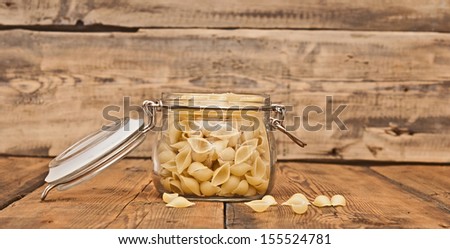 Pasta in the form of shells in a glass jar