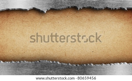 Torn metal texture over old paper
