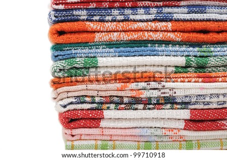Pile of linen kitchen towels on a white background. space for your text