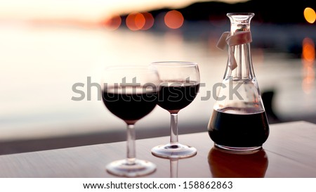 red wine for two in sunset
