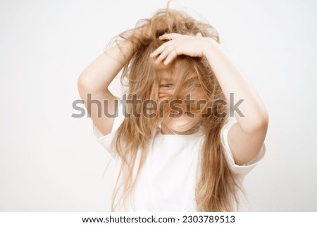 Image, Stock Photo Little girl covering face with big branch