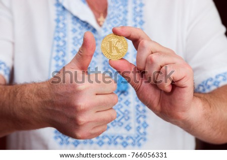 Cryptocurrency coins (Karbo aka Karbovanets) in a hand of a Ukrainian Zdjęcia stock © 