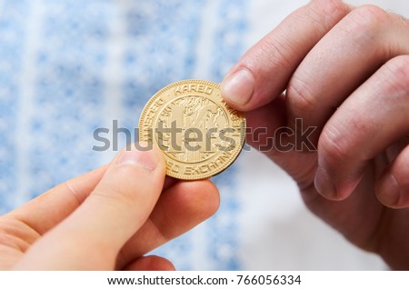 Exchange cryptocurrency coins (Karbo aka Karbovanets) between two hands between two people Zdjęcia stock © 