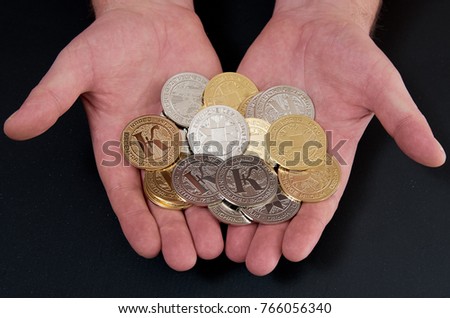 Cryptocurrency coins (Karbo aka Karbovanets) in a hand presenting Zdjęcia stock © 