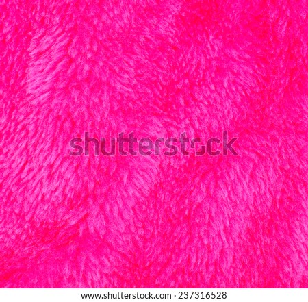 Luxurious wool texture from a pink sheepskin rug