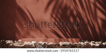 Summer mockup concept for product presentation. Red brown podium and pebble on brown stucco background. Clipping path of each element included. 3d rendering illustration. 