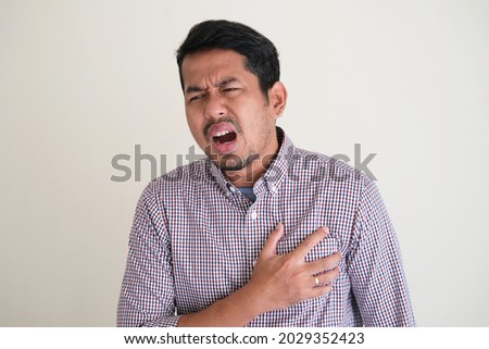 Asian man got chest pain expression Stok fotoğraf © 