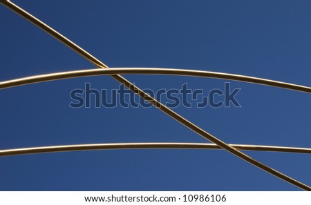 - a bent metal structure against blue sky