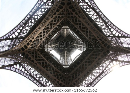 Similar – Image, Stock Photo Under the Eiffel Tower .  With light and shadow . Above me the Great Steel Frame . In the background a skyscraper and many trees.