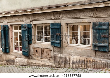 Old blue shutters and art shop windows, old town Tuebingen.