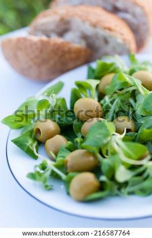 Olive salad with corn salad and home baked bread.