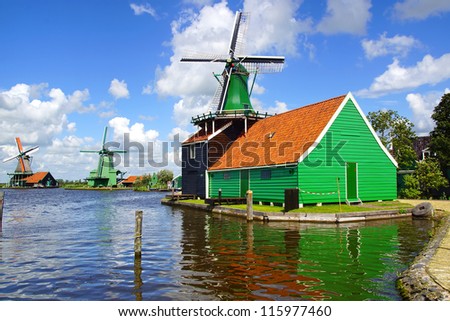 ZAANDAM, Holland - JULY 30: Windmills in Zaandam.Hundreds of wind powered industrial mills made the Zaan region world famous.In most of the mills still live people; July 30, 2012 in Zaandam, Holland