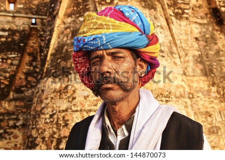 CHITTORGARH, INDIA - JANUARY 14: Portrait of an old man in a traditional turban on the street of the city on January 14, 2012 in Cittorgarh, India. Turbans reflect culture, profession of person.