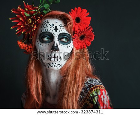 photo portrait of red haired girl with red flowers in her hair makeup Los Muertos