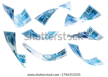 banknotes of 100 reais of brazil falling on isolated white background. Grand prize, lottery or wealth concept.