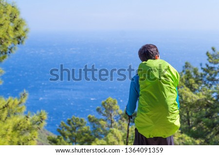 Similar – Anonymer Mann genießt Berglandschaft und See