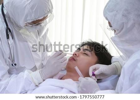 Similar – Image, Stock Photo rt-PCR COVID-19 virus disease diagnostic test,lab technician wearing blue protective gloves holding test tube with swabbing stick,swab sample equipment kit & CDC form specimen submitting guidelines