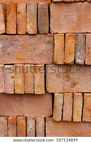 Store of bricks ready for building or sale. Construction materials and outdoor storage. Abstract background.