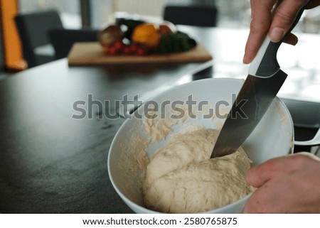 Similar – Image, Stock Photo Cooking doughnuts process. Homemade dough and deep-fried donuts, top view