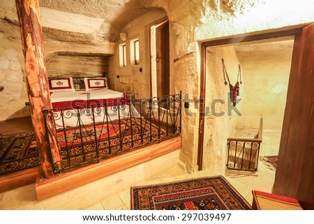 GOREME, TURKEY - APRIL 13, 2014: Cave bedroom on APRIL 13, 2014 in Cappadocia, Turkey. The best historic mansions and cave houses for tourist stays are in  Goreme, Cappadocia, Turkey.