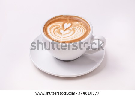Cup of art latte on a cappuccino coffee isolated on white background ストックフォト © 