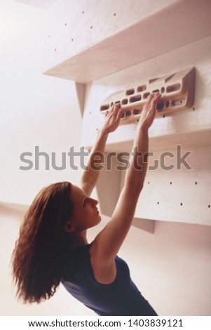 Women training on climbing fingerboard  商業照片 © 
