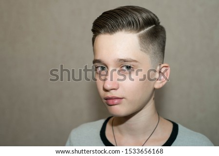 Stylish Modern Retro Haircut Side Part With Mid Fade With Parting Of School Boy Guy In A Barbershop On A Brown Background Stock Fenykep Shutterstock Puzzlepix