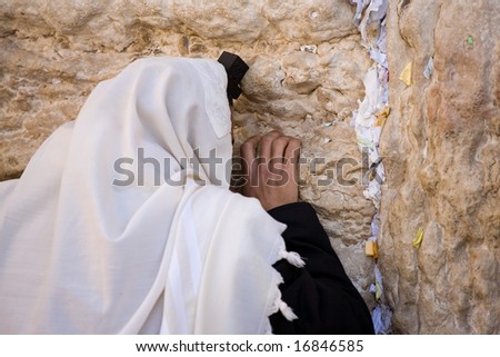 Praying Jew on Jerusalem Western wall during sabbath.