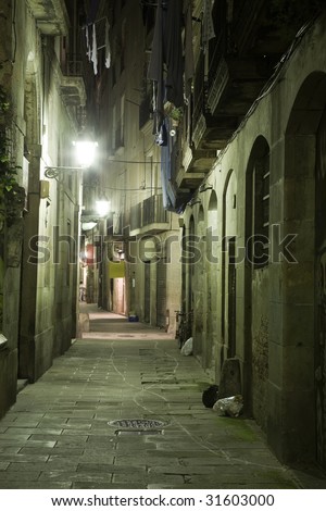 Gothic quarter at night. Lane with lamp in Gothic quarter in Barcelona